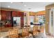 Modern kitchen with granite countertops, stainless steel appliances, and barstool seating at 2020 Windcrest Lake Cir, Orlando, FL 32824