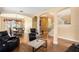 Open-concept living space with archways, a staircase, hardwood flooring, and a dining area view at 2020 Windcrest Lake Cir, Orlando, FL 32824
