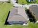 Captivating aerial view of a home's roof, surrounded by lush greenery, set in a tranquil, well-maintained neighborhood at 2120 Betsy Ross Ln, St Cloud, FL 34769