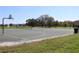 Outdoor basketball court with a view of the community park, trees and residential area at 2120 Betsy Ross Ln, St Cloud, FL 34769
