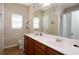 Bright bathroom with a double vanity, large mirror, and shower-tub combination at 2120 Betsy Ross Ln, St Cloud, FL 34769