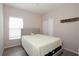 Cozy bedroom with a queen-size bed, natural light, and a serene atmosphere at 2120 Betsy Ross Ln, St Cloud, FL 34769