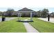 Community area featuring a gazebo, basketball court, sand volleyball pit, and grassy lawns at 2120 Betsy Ross Ln, St Cloud, FL 34769