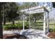 Scenic community gazebo offers a peaceful retreat surrounded by lush trees and greenery at 2120 Betsy Ross Ln, St Cloud, FL 34769