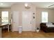 Inviting entryway featuring tile flooring, a white front door, and neutral wall paint that creates a warm and welcoming ambiance at 2120 Betsy Ross Ln, St Cloud, FL 34769