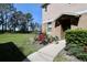 Townhome featuring lush garden bed at 2120 Betsy Ross Ln, St Cloud, FL 34769