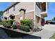 Townhome exterior with well-maintained landscaping, providing curb appeal and a pleasant environment at 2120 Betsy Ross Ln, St Cloud, FL 34769