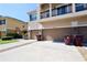 Townhome garages with individual entrances and convenient driveway parking at 2120 Betsy Ross Ln, St Cloud, FL 34769