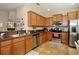 Modern kitchen featuring updated appliances, ample counter space, and plenty of natural light creating a functional and inviting space at 2120 Betsy Ross Ln, St Cloud, FL 34769