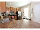 Spacious kitchen with stainless steel appliances, double sink, and adjacent breakfast nook at 2120 Betsy Ross Ln, St Cloud, FL 34769