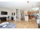 Bright, open-concept layout with tile floors, kitchen, staircase, and comfortable living space at 2120 Betsy Ross Ln, St Cloud, FL 34769