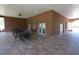Outdoor patio area with brick flooring, ceiling fans, tables, and chairs for lounging at 2120 Betsy Ross Ln, St Cloud, FL 34769