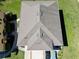 Aerial close up of a modern roof design with skylights and impeccable maintenance, showcasing quality and style at 2120 Betsy Ross Ln, St Cloud, FL 34769