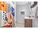 Charming bathroom with a colorful shower curtain, updated vanity, and a bright window at 2237 Avenue B Nw, Winter Haven, FL 33880