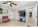 Bedroom featuring a comfortable sitting area, wardrobe, and hallway access at 2237 Avenue B Nw, Winter Haven, FL 33880