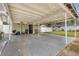 Carport featuring a spacious, shaded area perfect for parking and outdoor activities at 2237 Avenue B Nw, Winter Haven, FL 33880