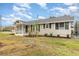 Charming single-story home featuring a well-manicured front yard, cozy porch, and neat landscaping at 2237 Avenue B Nw, Winter Haven, FL 33880