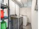 Basement laundry area with updated washer and dryer hookups and exposed ceiling at 2237 Avenue B Nw, Winter Haven, FL 33880
