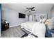 The light-filled bedroom has gray walls, ample natural light, and wood-look laminate flooring at 2461 Bulrush Dr, St Cloud, FL 34769