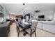 Open-concept layout with a dining area seamlessly connected to the kitchen and living room at 2461 Bulrush Dr, St Cloud, FL 34769