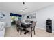 A stylish dining room features a modern light fixture and a table set with blue accents at 2461 Bulrush Dr, St Cloud, FL 34769