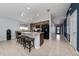 Modern kitchen features granite countertops, tile flooring, a breakfast bar, and updated appliances at 2461 Bulrush Dr, St Cloud, FL 34769