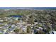 Spacious aerial view of a neighborhood with lake, mature trees, and single-Gathering homes at 2654 Derbyshire Rd, Maitland, FL 32751