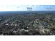 Expansive aerial view showcasing the neighborhood's mature trees, proximity to Winter Park and Orlando at 2654 Derbyshire Rd, Maitland, FL 32751