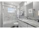 Updated bathroom featuring a shower over tub and a granite vanity at 2654 Derbyshire Rd, Maitland, FL 32751