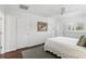 This bedroom features white walls, hardwood floors, crown molding, and a ceiling fan at 2654 Derbyshire Rd, Maitland, FL 32751