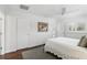 Bright bedroom with white walls, hardwood floor, a ceiling fan and natural light at 2654 Derbyshire Rd, Maitland, FL 32751