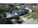 Aerial view of a well-maintained house with mature landscaping and a paved driveway at 2654 Derbyshire Rd, Maitland, FL 32751