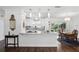 Stylish kitchen with a marble countertop island, pendant lighting, and stainless steel appliances at 2654 Derbyshire Rd, Maitland, FL 32751