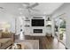 Living room with fireplace feature wall and sliding glass doors to patio at 2654 Derbyshire Rd, Maitland, FL 32751
