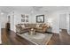 Comfortable living room with a large sectional sofa and decorative rug at 2654 Derbyshire Rd, Maitland, FL 32751