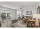 Open-plan living room with seamless flow to kitchen at 2654 Derbyshire Rd, Maitland, FL 32751