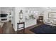 Inviting open-concept living space featuring hardwood floors, a kitchen island, and modern decor at 2654 Derbyshire Rd, Maitland, FL 32751