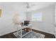 Bright office with a white desk, stylish rug, and shuttered windows at 2654 Derbyshire Rd, Maitland, FL 32751
