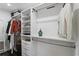 Spacious walk-in closet with custom shelving and hanging racks for optimal storage solutions at 2654 Derbyshire Rd, Maitland, FL 32751
