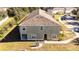 An aerial view displays the property with a lawn, trees, and its location near other apartments at 2851 Sunstone Dr # 2851, Kissimmee, FL 34758