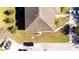 Aerial view of a home with a well-maintained lawn, driveway, and shingle roof on a sunny day at 2851 Sunstone Dr # 2851, Kissimmee, FL 34758