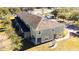 An aerial view displays the property with a lawn, trees, and its location near other apartments at 2851 Sunstone Dr # 2851, Kissimmee, FL 34758