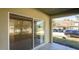 A covered patio features a tile floor and a sliding glass door for indoor-outdoor living at 2851 Sunstone Dr # 2851, Kissimmee, FL 34758