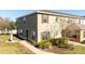 Exterior shot of a two-story townhouse with a manicured lawn and a pathway leading to the entrance at 2851 Sunstone Dr # 2851, Kissimmee, FL 34758