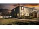 Exterior shot of the two-story townhouse with a walkway and healthy lawn at 2851 Sunstone Dr # 2851, Kissimmee, FL 34758