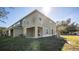 Exterior view of the house showcasing the backyard and ample green space at 2851 Sunstone Dr # 2851, Kissimmee, FL 34758