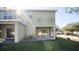 Exterior view of the house showcasing the backyard and ample green space at 2851 Sunstone Dr # 2851, Kissimmee, FL 34758