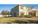 Exterior shot of a two-story home with a manicured lawn and a walkway in front at 2851 Sunstone Dr # 2851, Kissimmee, FL 34758