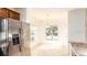Bright kitchen with a stainless steel refrigerator, breakfast nook, and window at 2851 Sunstone Dr # 2851, Kissimmee, FL 34758