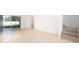 Spacious living room with tile flooring, white walls, and a sliding glass door leading to the outside at 2851 Sunstone Dr # 2851, Kissimmee, FL 34758